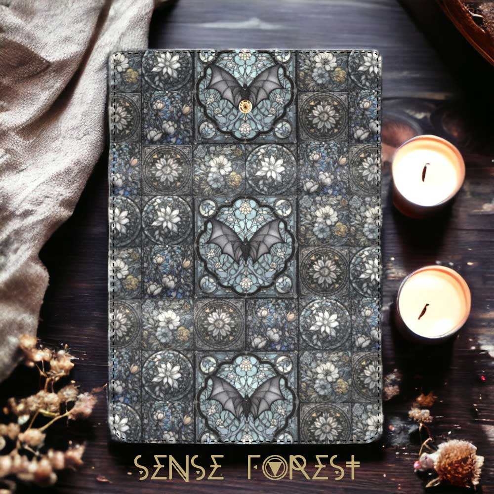 Medieval stained glass bat design satchel bag with matching wallet from Sense Forest on dark wood surface.