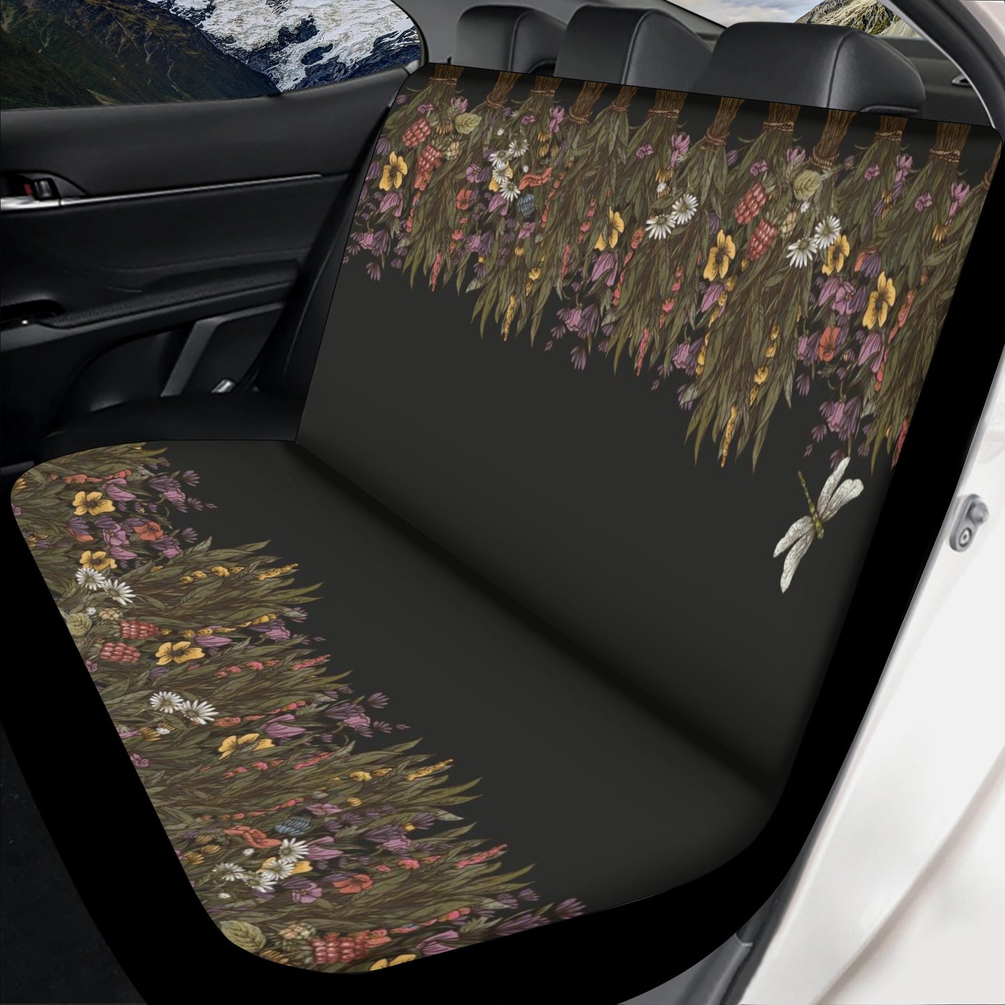 Black car seat cover with dried flower design in earthy tones and delicate butterfly accents, Sense Forest style.