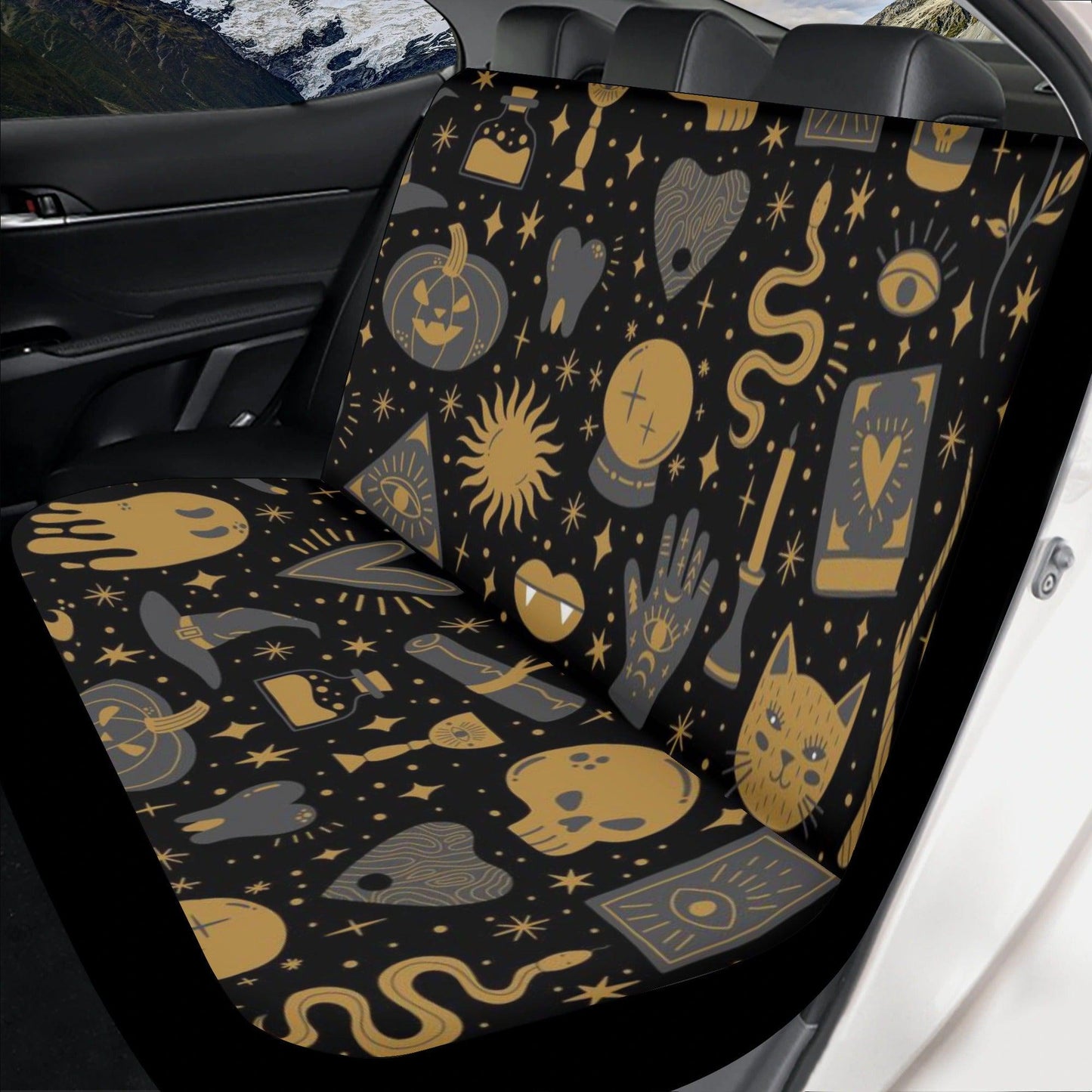 Black car seat cover with Halloween spooky ghost and gothic symbols in gold, Sense Forest design.
