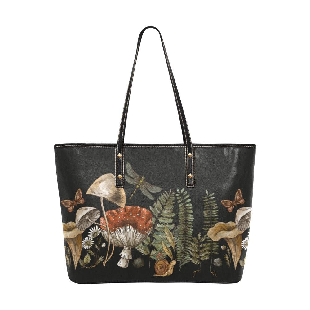 Black vegan leather zip tote bag featuring detailed mushrooms, ferns, and forest elements in Sense Forest style.