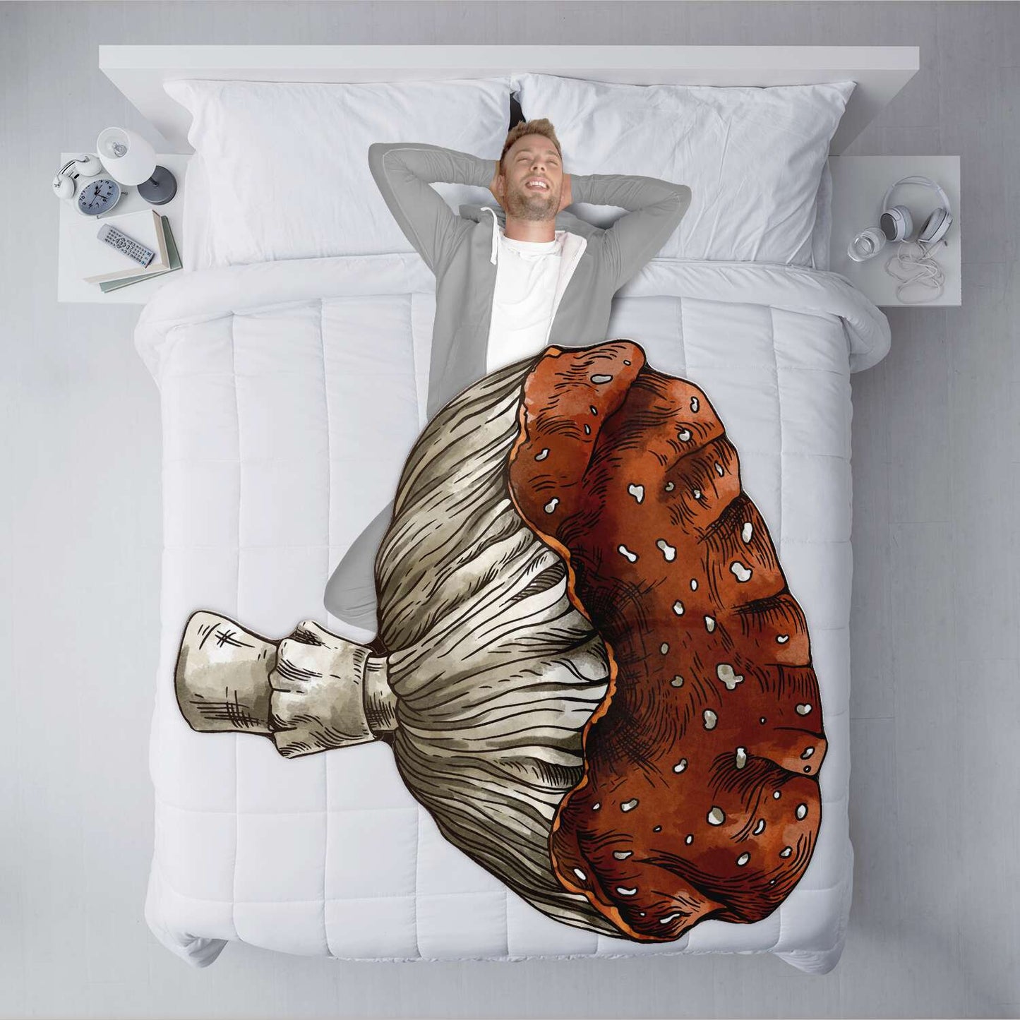 XL mushroom-shaped blanket in red and white with detailed gills design, spread on white bedding, Sense Forest style.