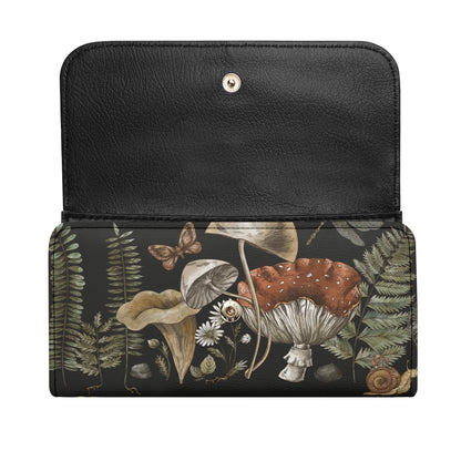 The Cottagecore Mushroom Fern Trifolds Womens Long Clutch Wallet features black PU leather with charming woodland illustrations of mushrooms, ferns, daisies, a butterfly, and a snail for a whimsical touch.