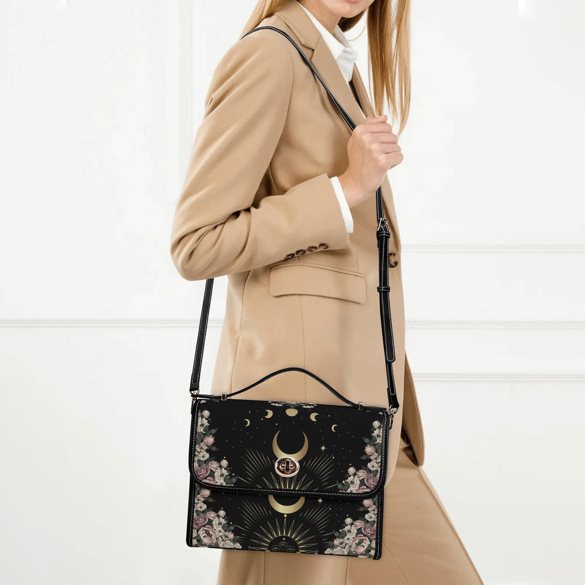 woman in suit is carrying a Pale Rose Moon Phase Witchy Vegan Leather satchel bag by Sense Forest