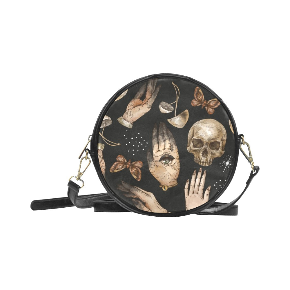 Black round purse with spooky ghost hands skull mushroom print on it, vegan leather crossbody bag, witchy purse